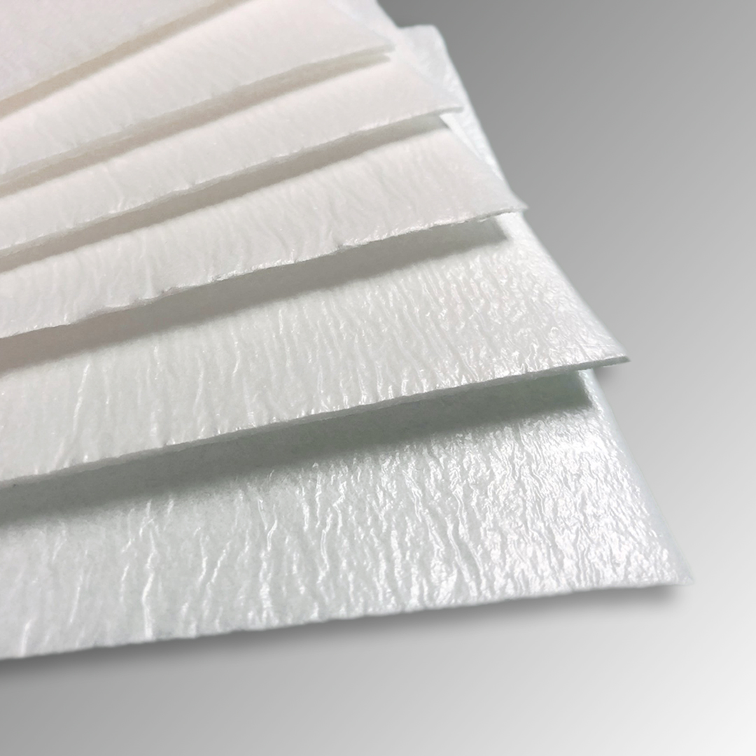 Multilayer absorbent pad designed for exudate management in fresh food packaging
