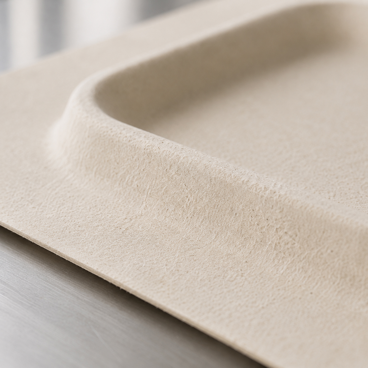 Close-up of fiber material shaped using dry molding technology