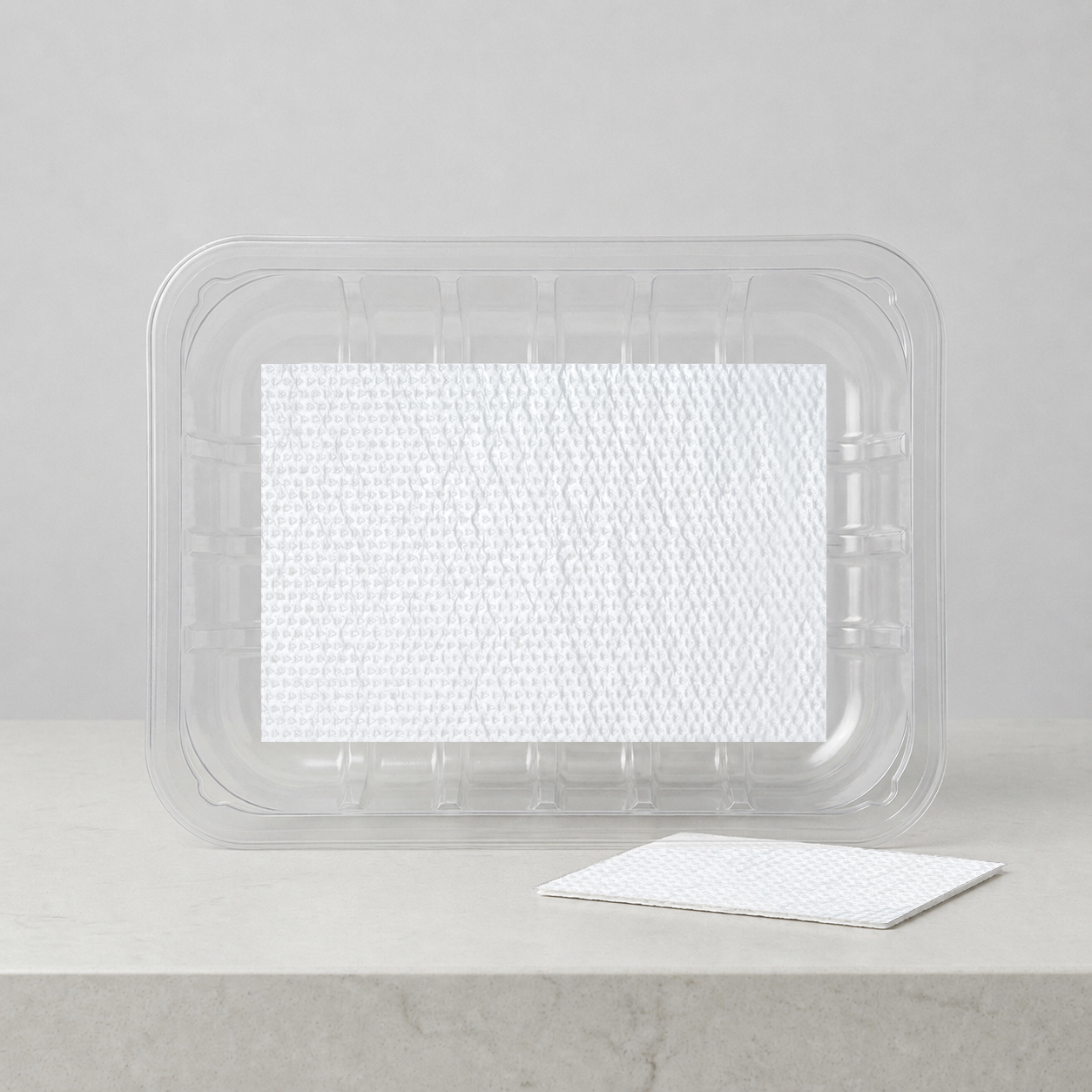 G-Pad compostable absorbent pad in a food packaging tray